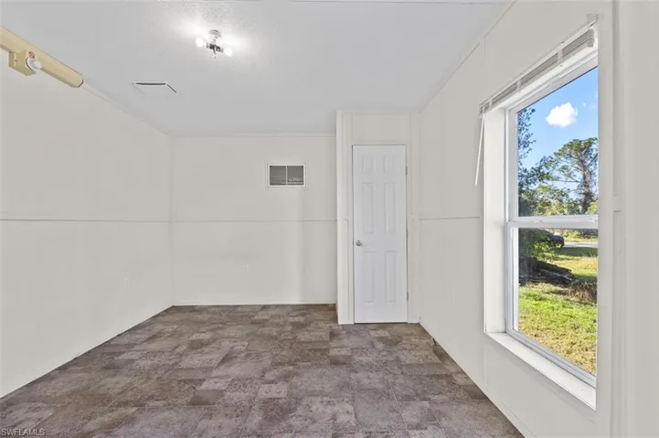 Unfurnished room with ornamental molding