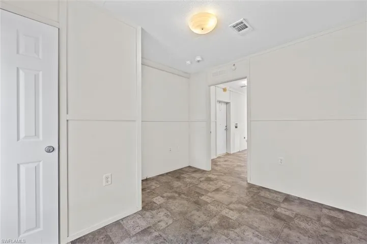 Spare room with a textured ceiling
