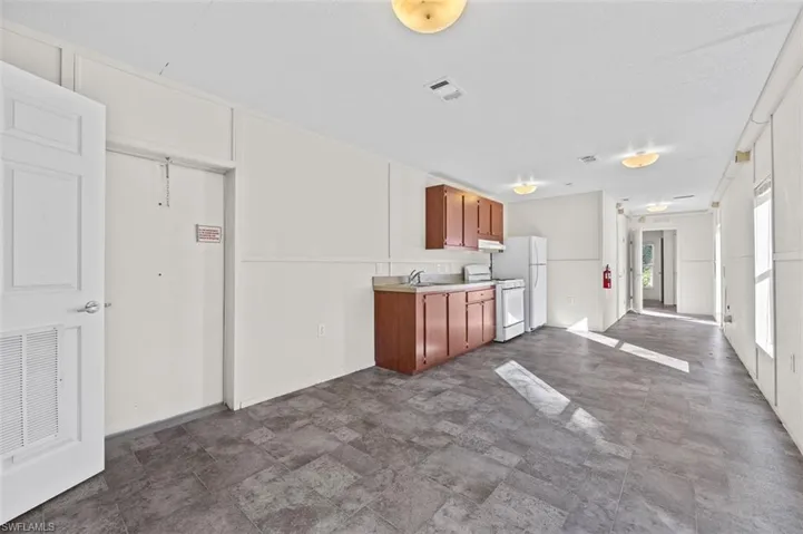 Kitchen featuring sink and white appliances