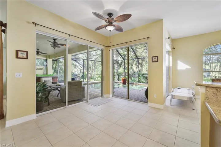 Entryway featuring a sunroom, tile patterned flooring, and healthy amount of natural light