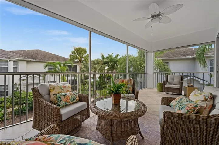 Sunroom featuring an outdoor hangout area, a balcony, and ceiling fan