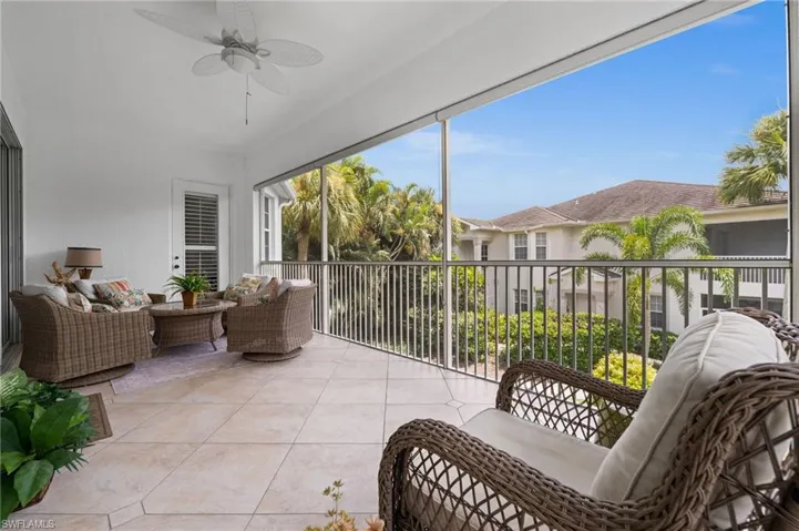 Sunroom with ceiling fan and outdoor lounge area