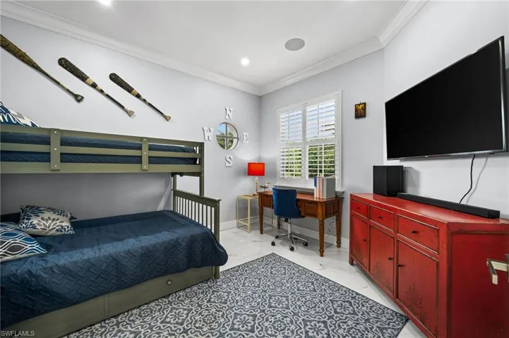 Bedroom featuring crown molding, a desk, recessed lighting, and light marble finish flooring