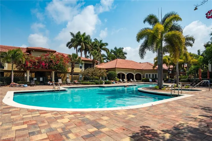 Community pool featuring a patio