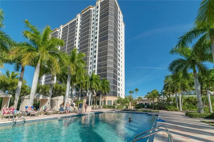 Community pool with a patio