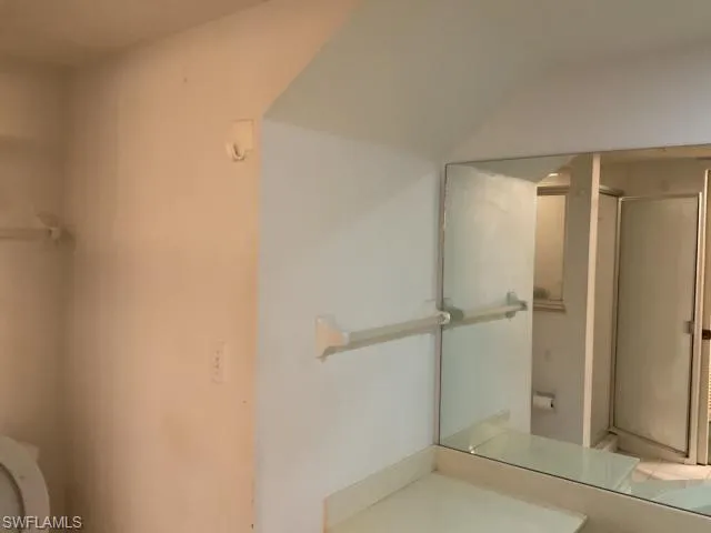 Full bathroom featuring vanity and a stall shower