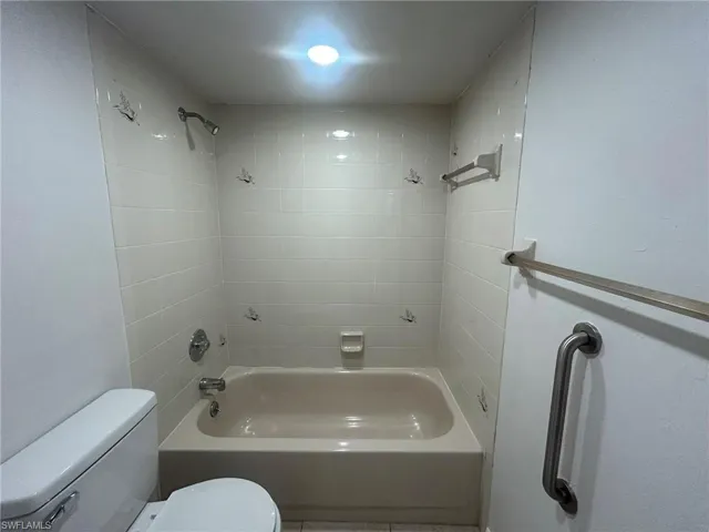 Full bathroom with bathtub / shower combination and toilet