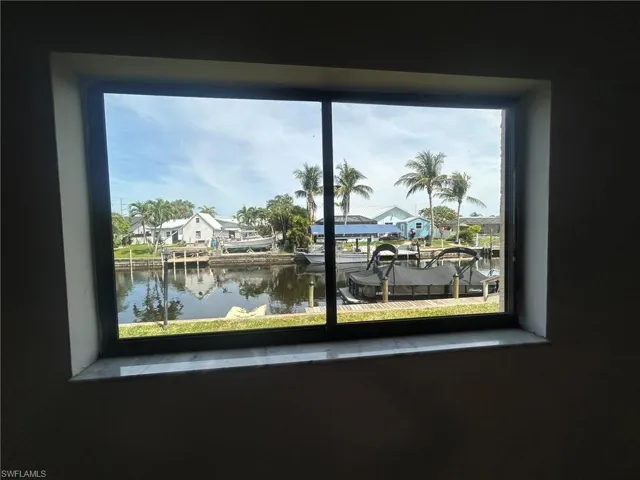 Details featuring a residential view and a water view