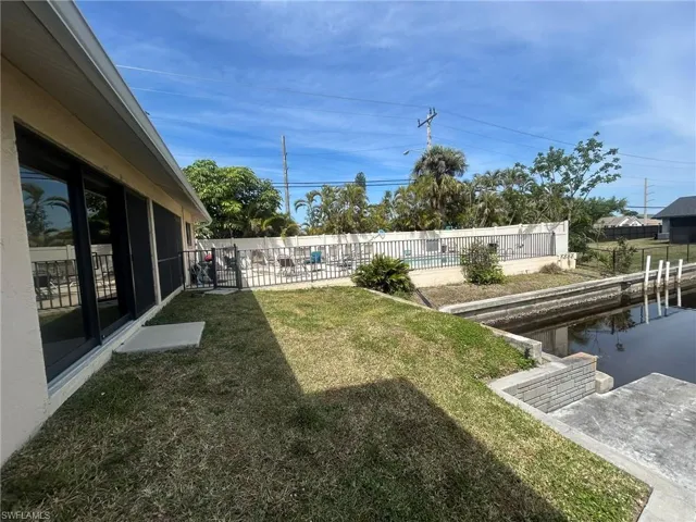 View of yard with a patio and fence