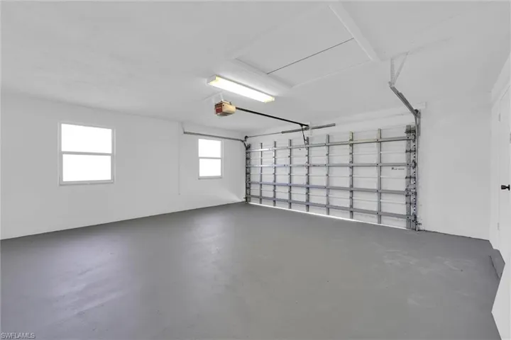 Garage featuring a garage door opener