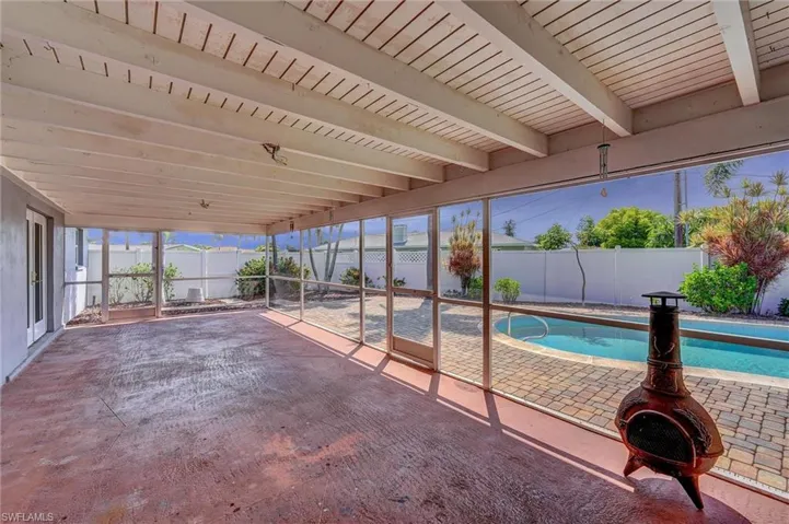 View of pool featuring a fenced backyard and a patio