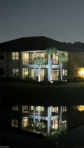 View of back of house at night