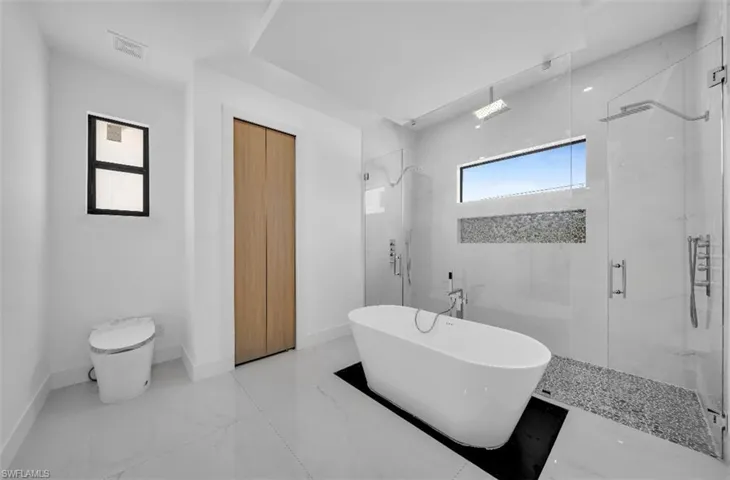 Bathroom with separate shower and tub
