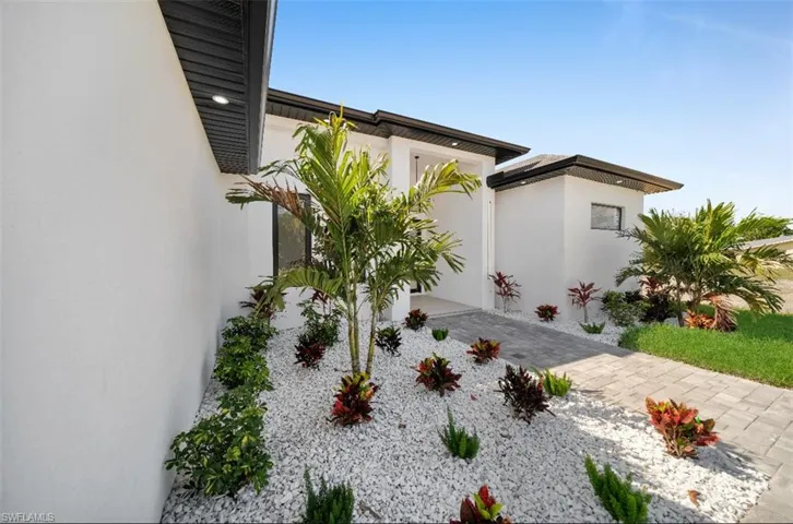 View of side of home with a patio area