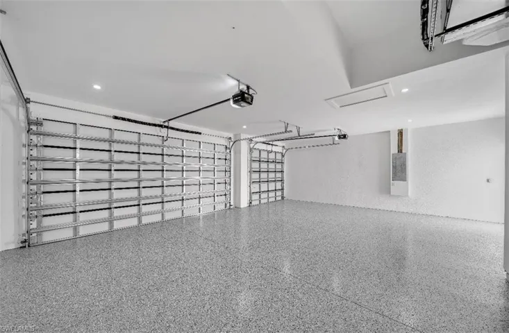 Garage with a garage door opener and electric panel