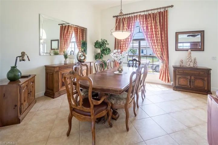 Dining space featuring light tile patterned floors
