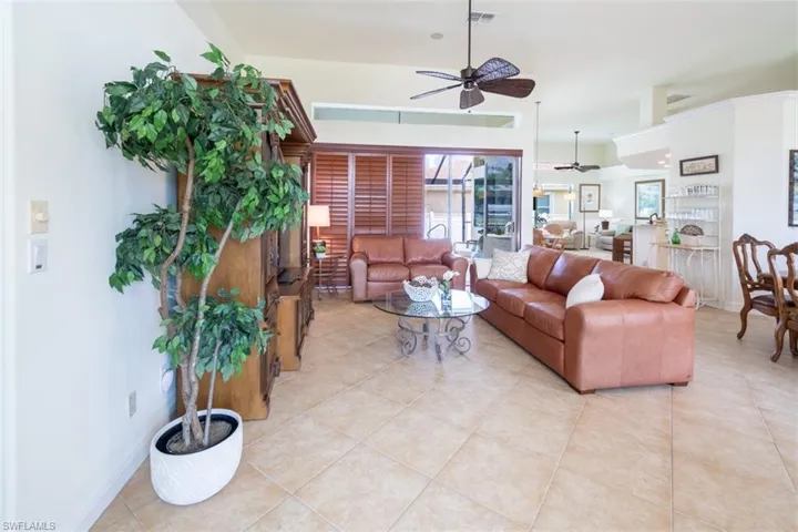 Tiled living room with ceiling fan