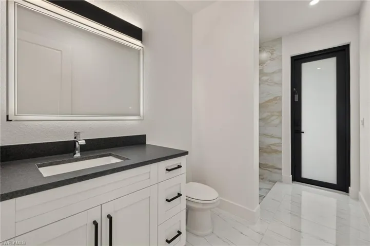 Bathroom with vanity and toilet