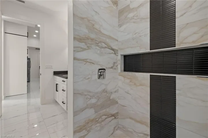Bathroom featuring vanity and walk in shower