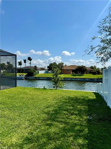 View of yard with a water view