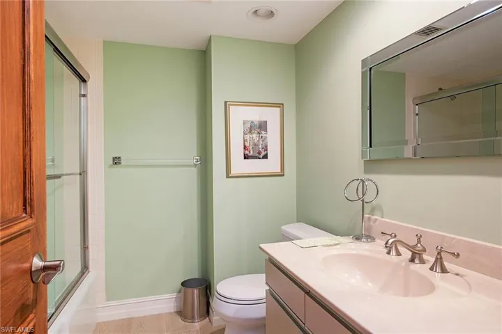 Full bathroom with vanity and shower / bath combination with glass door