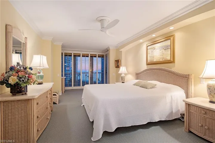Bedroom with crown molding, carpet, a ceiling fan, and access to outside