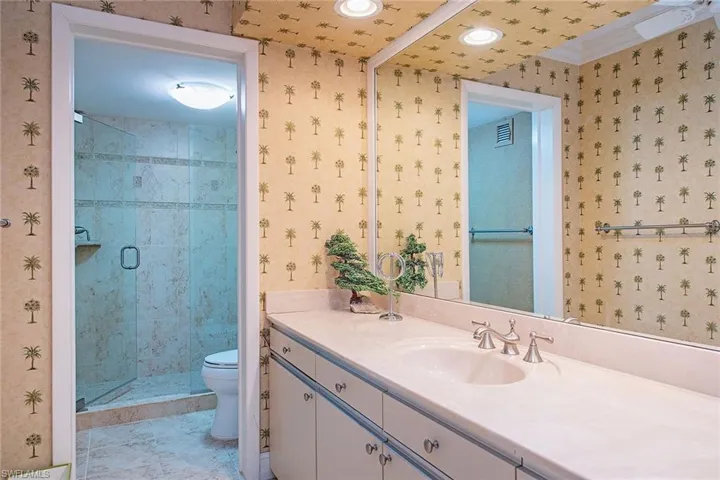 Full bath with vanity and a stall shower