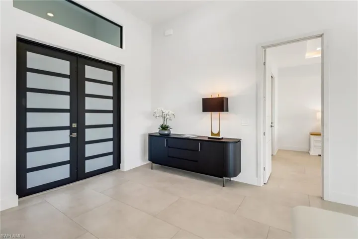 Foyer entrance with baseboards
