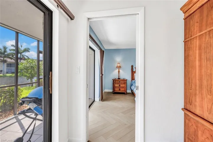 Enter main bedroom, a healthy amount of sunlight, doors from bedroom to lanai.