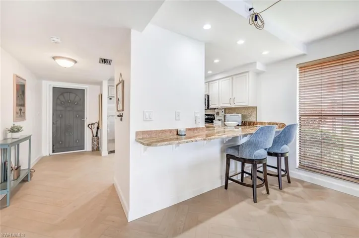 An extra dining area looking into the kitchen.