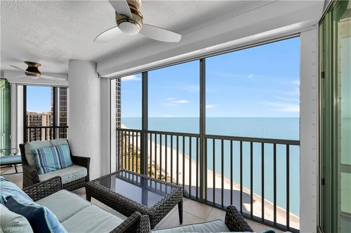 Sunroom / solarium with a water view