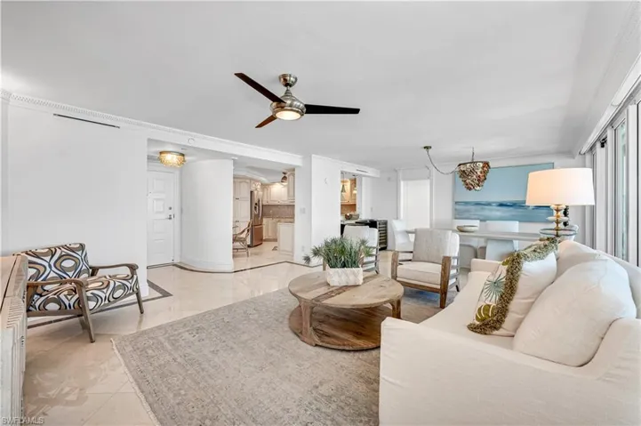 Living area featuring a ceiling fan