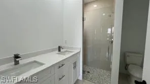 Dual vanity with integrated sinks and matte black fixtures