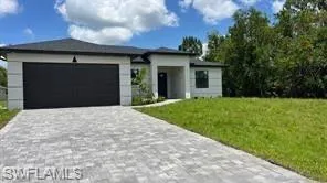 Contemporary single-story residence with a dark asphalt shingle roof