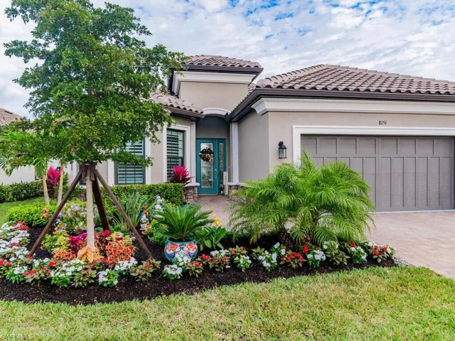 Mediterranean / spanish-style house with a garage