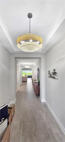 Recessed ceiling with a modern pendant light fixture