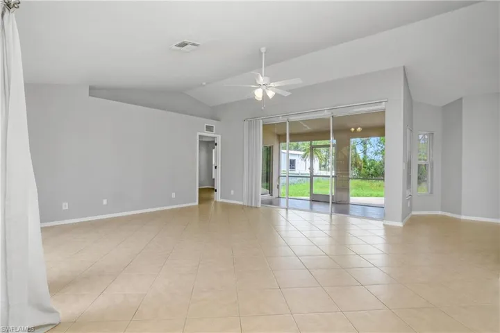 Large Tiled Living Room with lofted ceiling