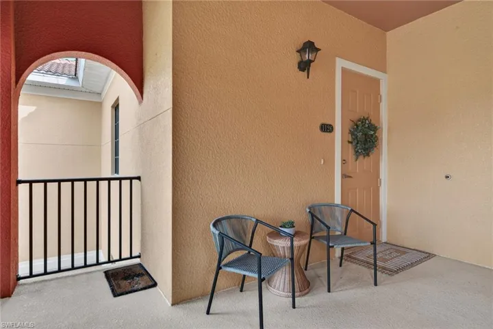 View of exterior entry featuring stucco siding