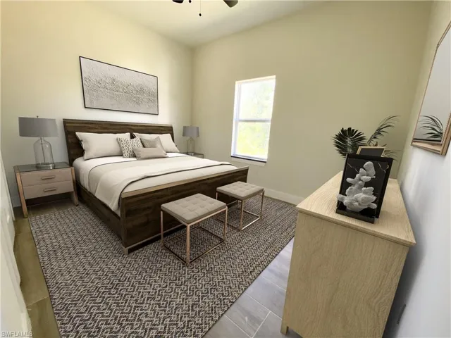 Bedroom with ceiling fan and dark hardwood / wood-style flooring