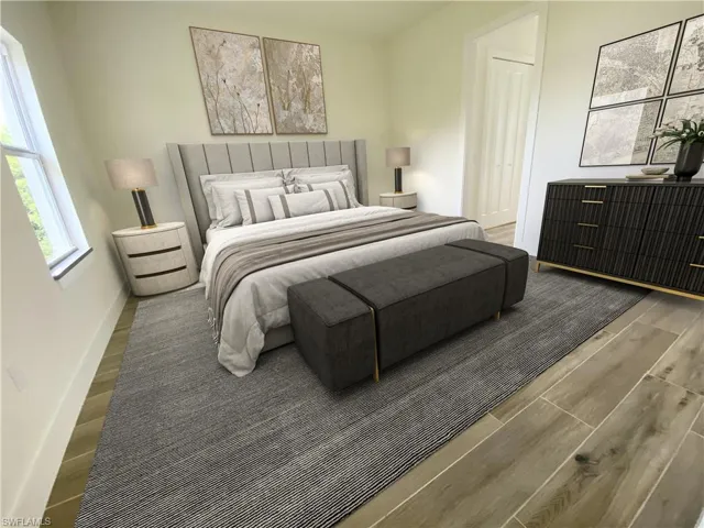 Bedroom featuring dark hardwood / wood-style floors