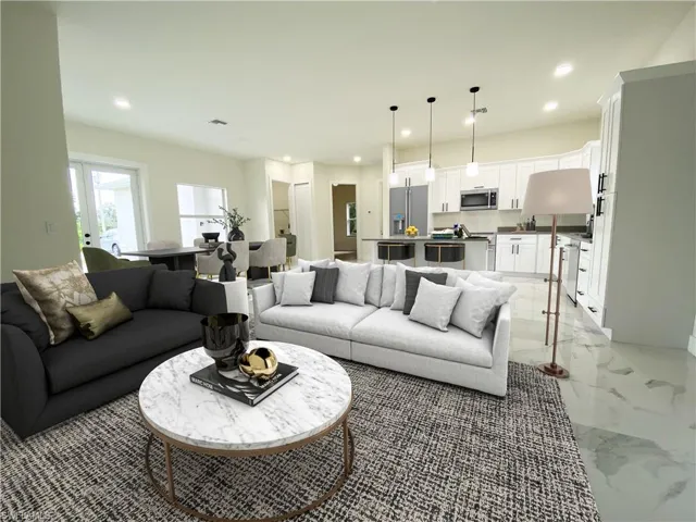 Living room featuring light tile floors