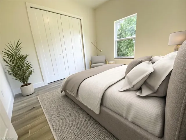 Bedroom featuring hardwood / wood-style flooring and a closet