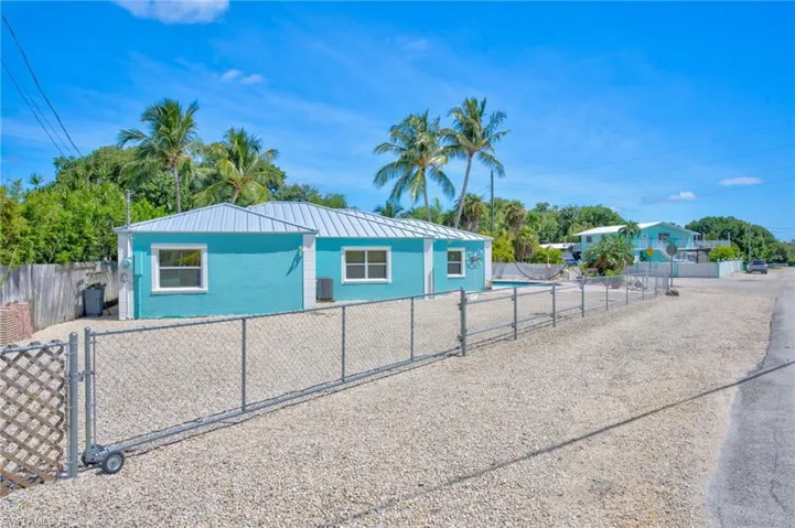 View of front of property featuring cooling unit