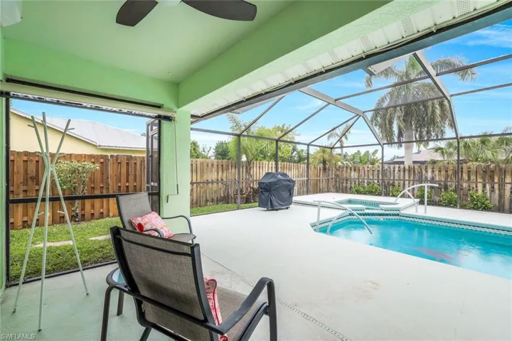 Screened in covered lani overlooking pool and yard.