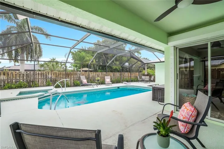 Privacy fenced back yard and screened in pool area.