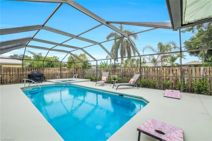 Screened in saltwater pool with whirpool spa.