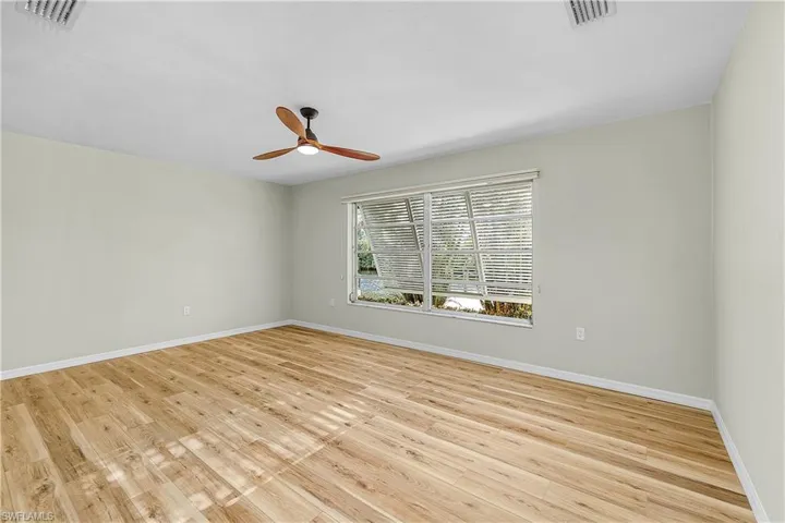 Entrance to primary bathroom featuring 2 walk in closets