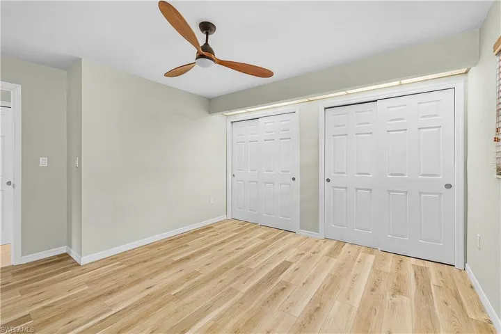 Second bedroom with privacy door separate from main living room, with bathroom