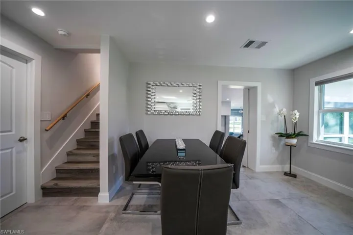 Dining area featuring stairs, recessed lighting, visible vents, and baseboards