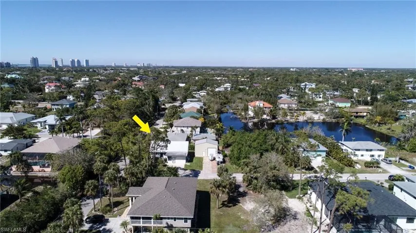 Bird's eye view featuring a water view and a residential view